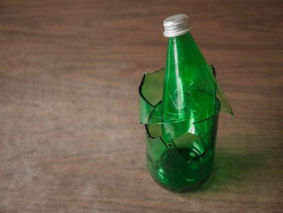 broken post consumer glass green bottle