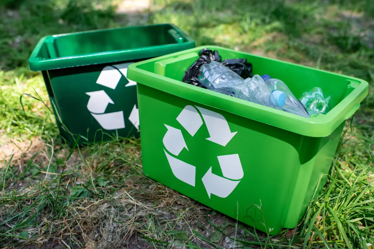 recycling symbol on bins with plastic